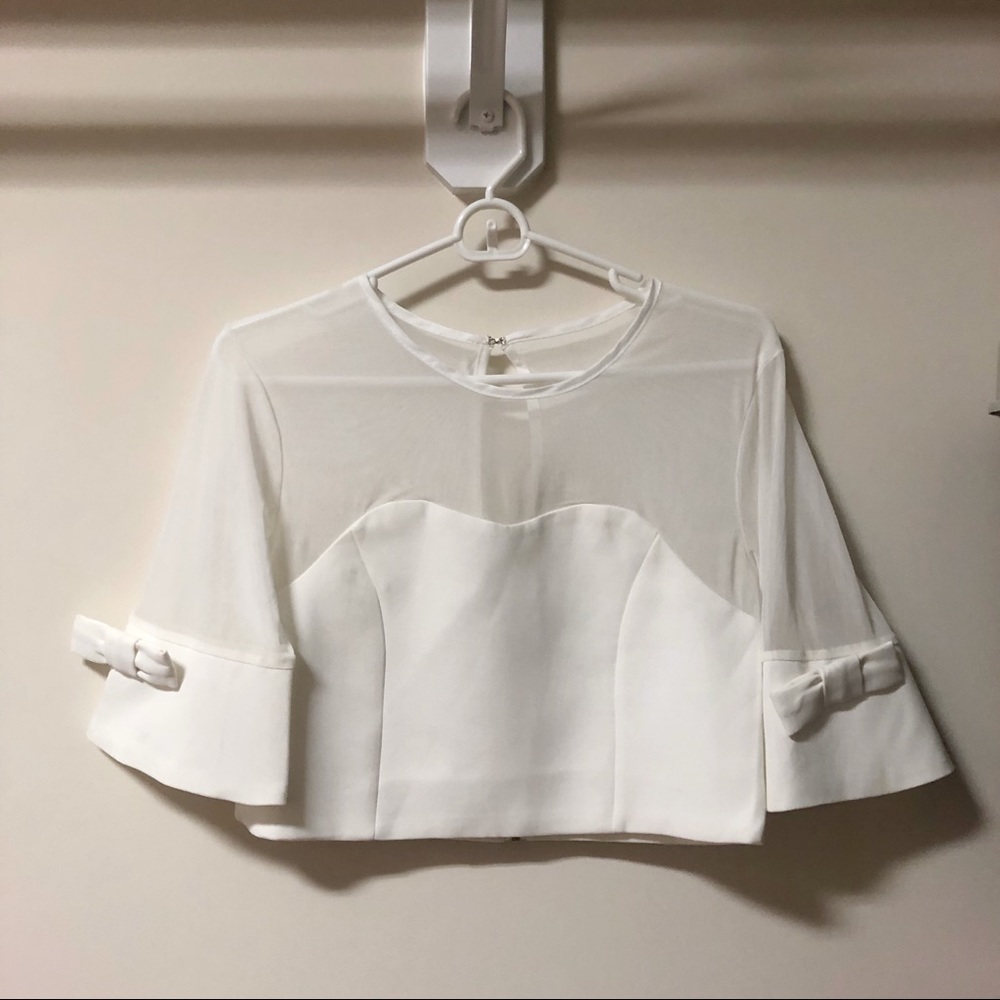 New white top with mesh and bow ties